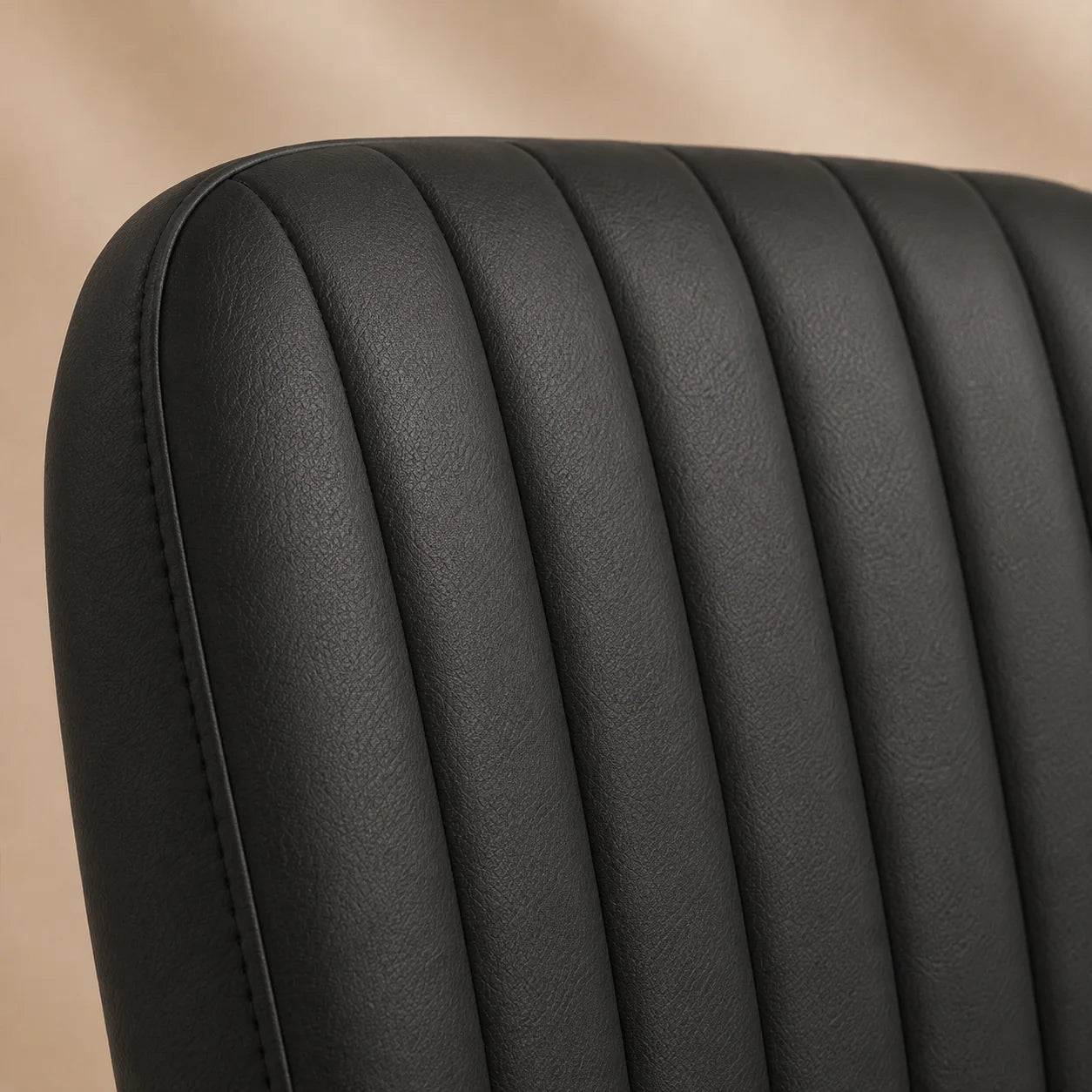 Close view of charcoal black MiraForm upholstery