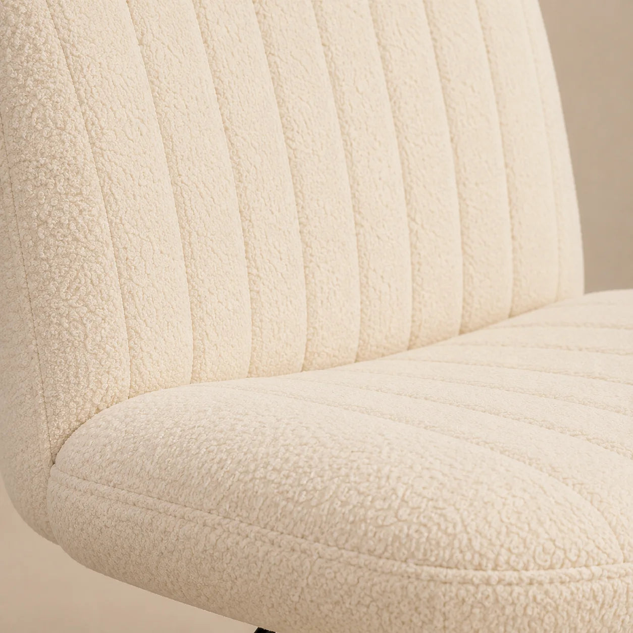 Close view of the cream textured MiraForm chair seat and stitched back